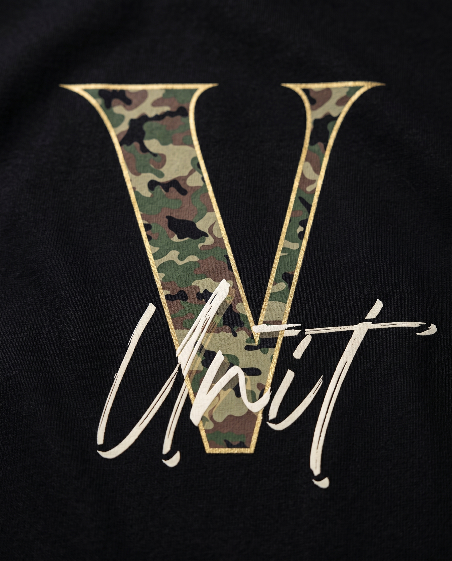 V-Unit camo design print close-up on black tee